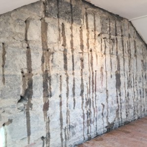 wall drilled and injected with chemical