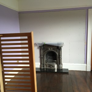 Area around fireplace showing plasterboard