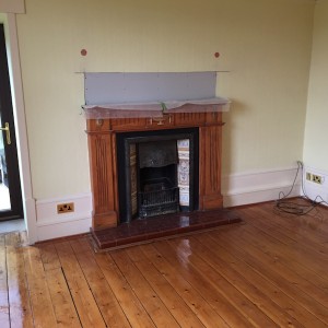 Area above fireplace showing plasterboard