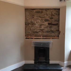 Exposed area above fireplace