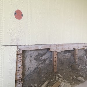 Exposed area above fireplace